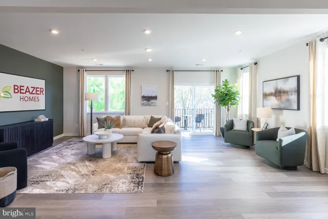 a living room with fireplace furniture and a wooden floor