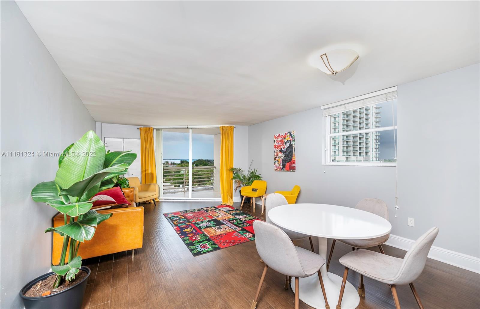 2400 Southwest 3rd Avenue, Unit 802 Miami, FL 33129 - Photo 13 of 26 a living room with furniture rug and a window