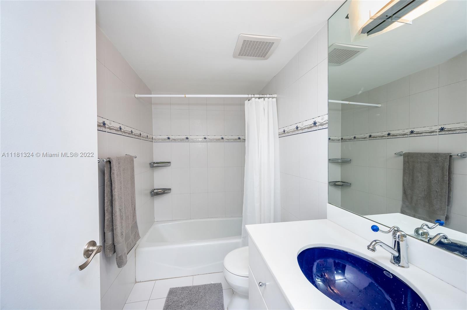 2400 Southwest 3rd Avenue, Unit 802 Miami, FL 33129 - Photo 22 of 26 a bathroom with a sink a toilet and shower