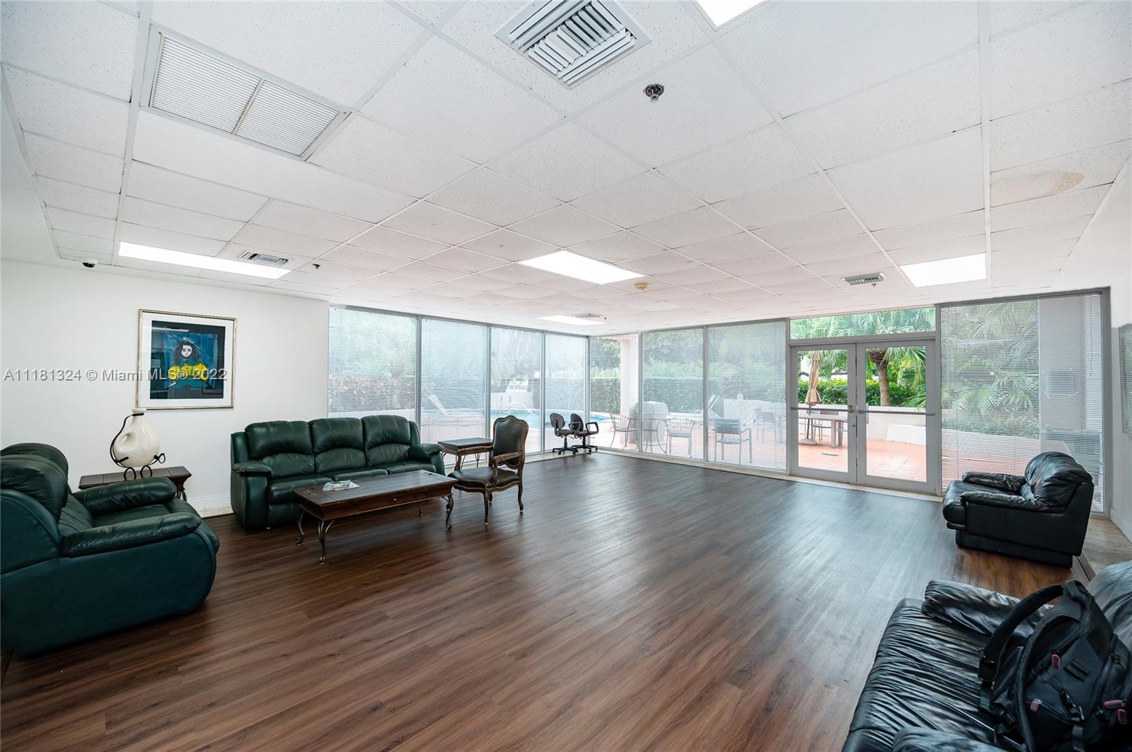 2400 Southwest 3rd Avenue, Unit 802 Miami, FL 33129 - Photo 24 of 26 a living room with furniture window and wooden floor
