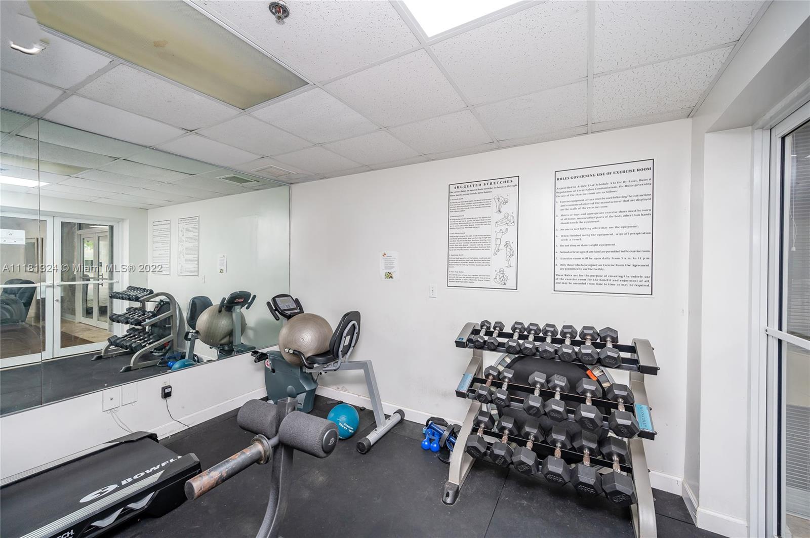 2400 Southwest 3rd Avenue, Unit 802 Miami, FL 33129 - Photo 25 of 26 a room with gym equipment and a window