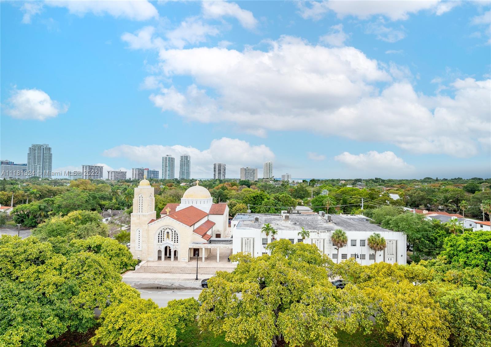 2400 Southwest 3rd Avenue, Unit 802 Miami, FL 33129 - Photo 9 of 26 a view of a city with lawn chairs and wooden fence