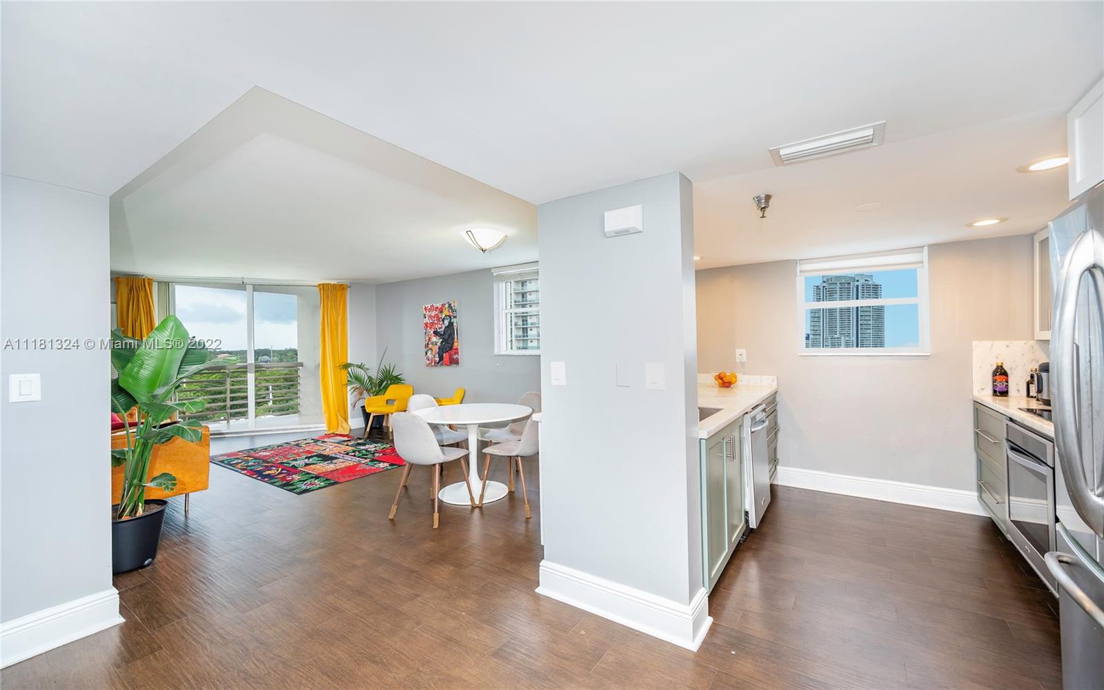 2400 Southwest 3rd Avenue, Unit 802 Miami, FL 33129 - Photo 10 of 26 a living room with furniture and a floor to ceiling window