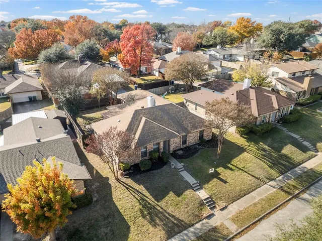 aerial view of a house with a ocean view