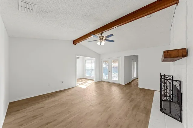 a view of an entryway with wooden floor