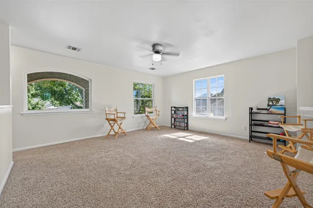 a view of a livingroom with furniture and a window