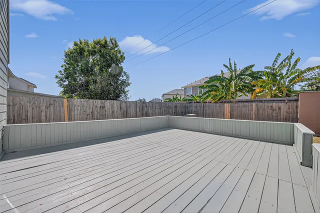 a view of outdoor space with deck and tree