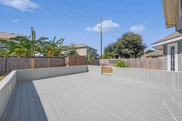 a view of a patio with a table and chairs