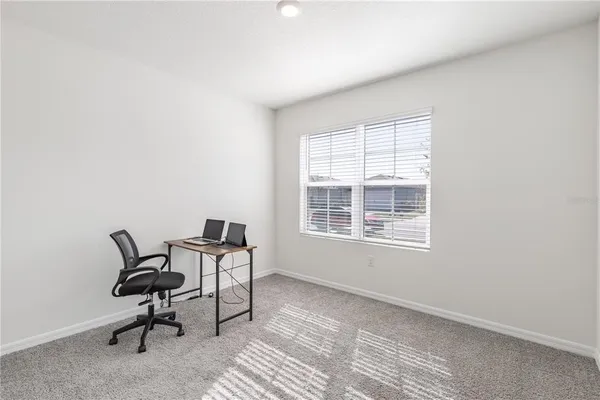 a workspace room with a window