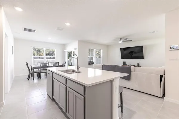 a view of living room filled with furniture and a flat screen tv