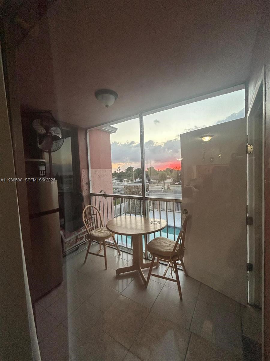 19771 Southwest 114th Avenue, Unit 329 Miami, FL 33157 - Photo 11 of 12 a balcony with chairs and a table