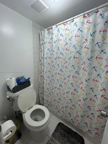 a bathroom with a toilet and a sink