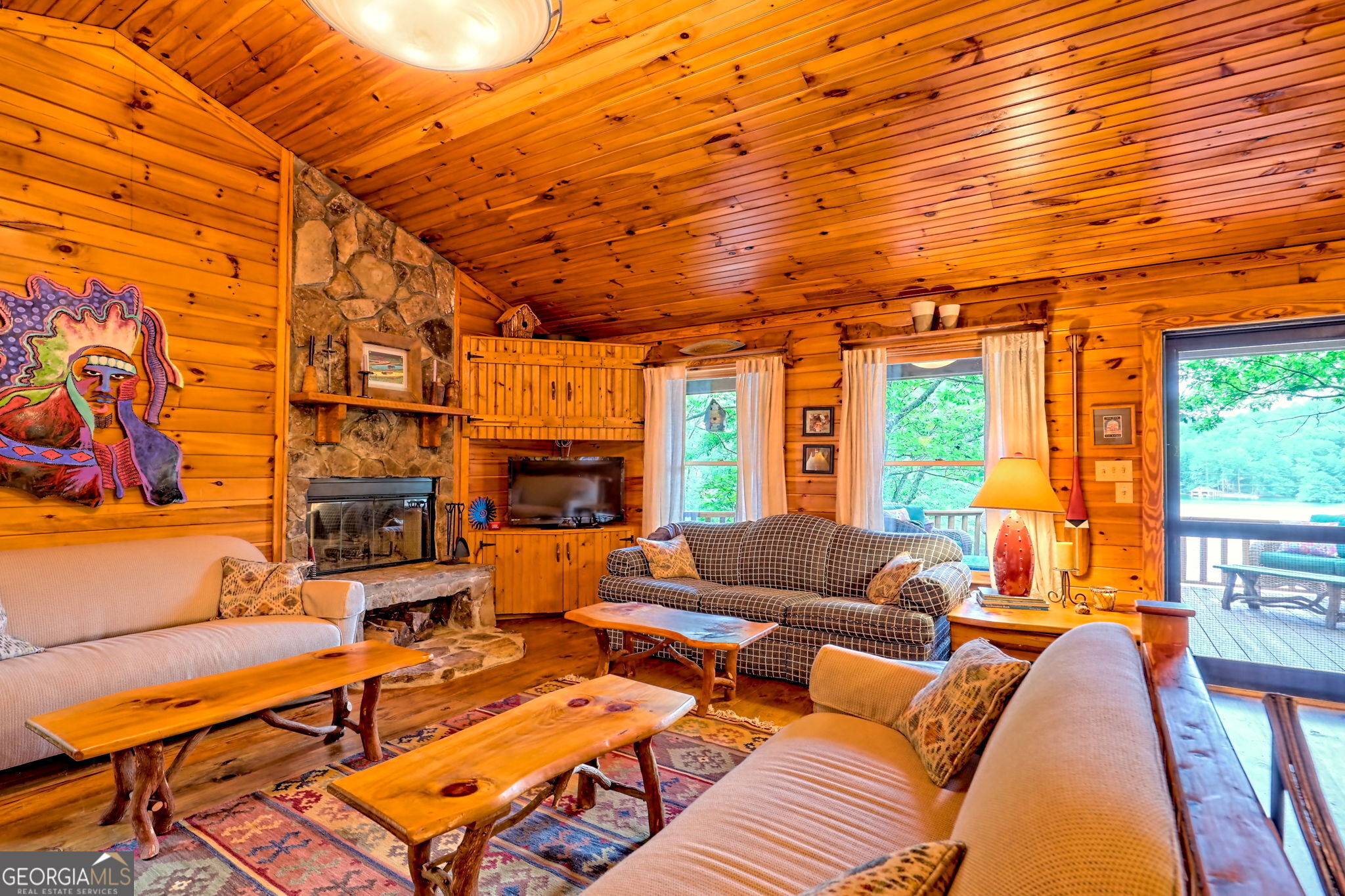 3019 Moccasin Creek Road Clarkesville, GA 30523 - Photo 11 of 72 a living room with furniture a fireplace and a large window