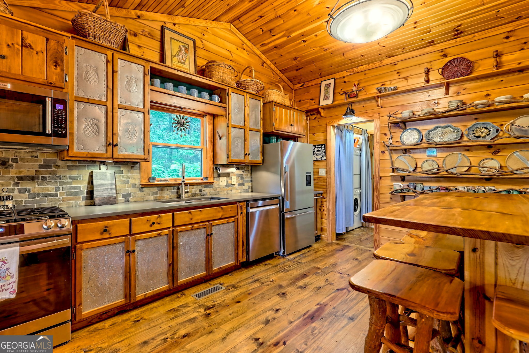 3019 Moccasin Creek Road Clarkesville, GA 30523 - Photo 14 of 72 a kitchen with stainless steel appliances granite countertop a sink and wooden cabinets