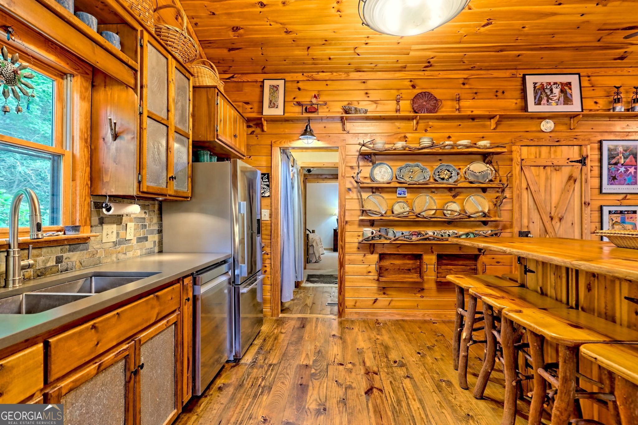 3019 Moccasin Creek Road Clarkesville, GA 30523 - Photo 15 of 72 a view of a bathroom with a sink and wooden floor