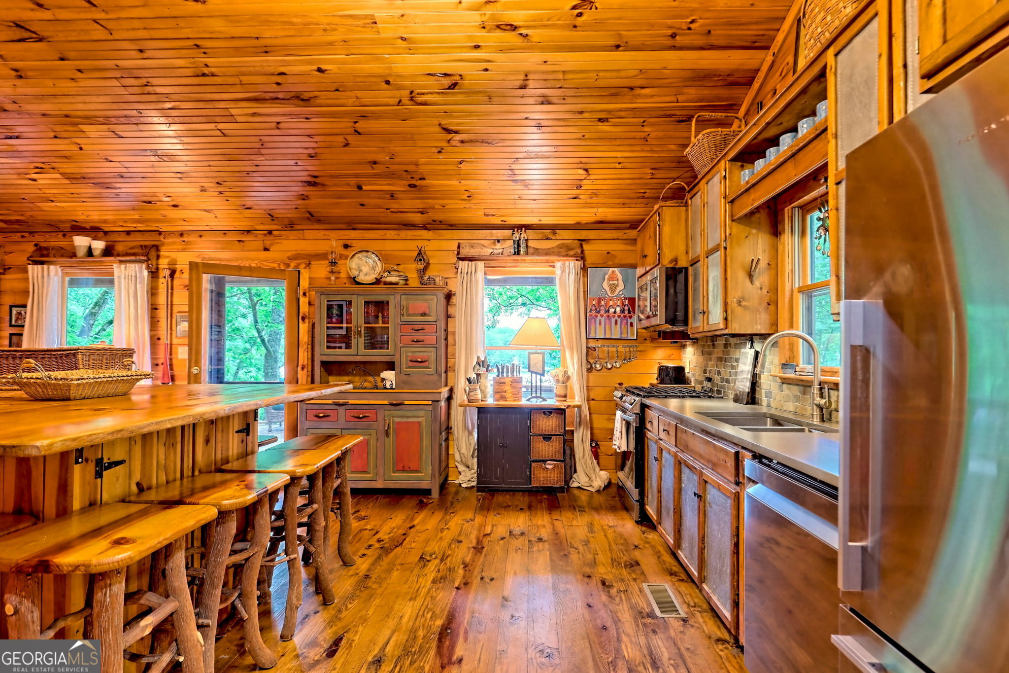 3019 Moccasin Creek Road Clarkesville, GA 30523 - Photo 16 of 72 a view of a living room with furniture and wooden floor