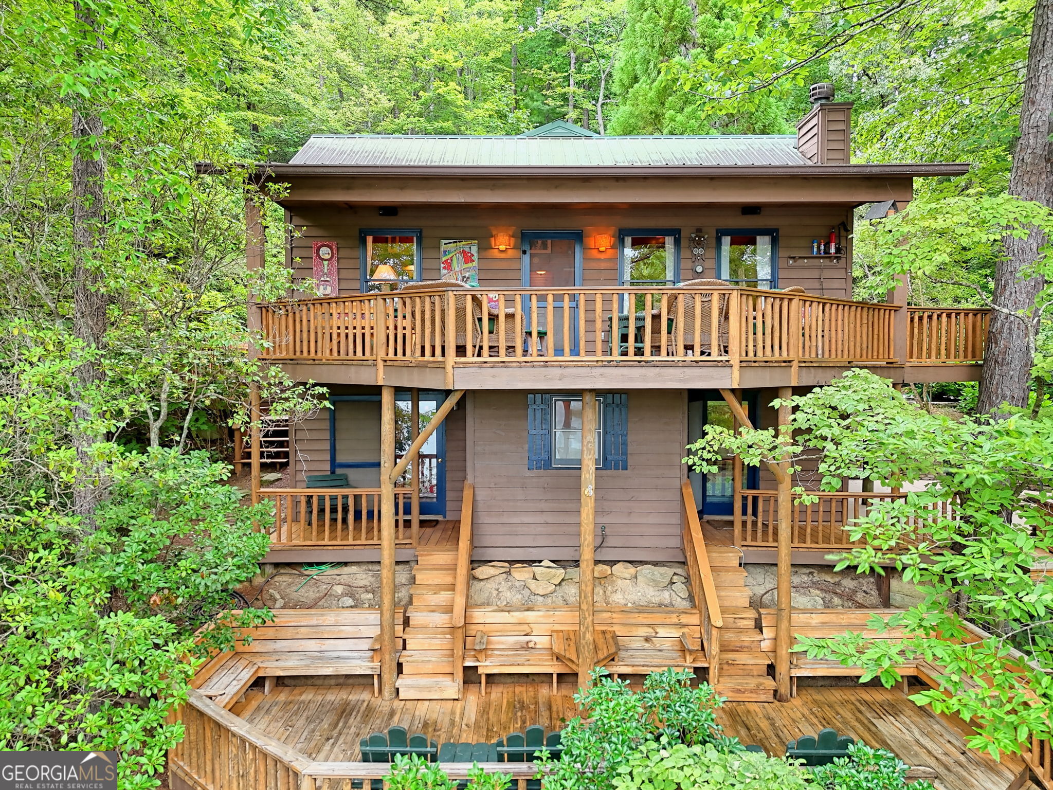 3019 Moccasin Creek Road Clarkesville, GA 30523 - Photo 3 of 72 a front view of a house with garden