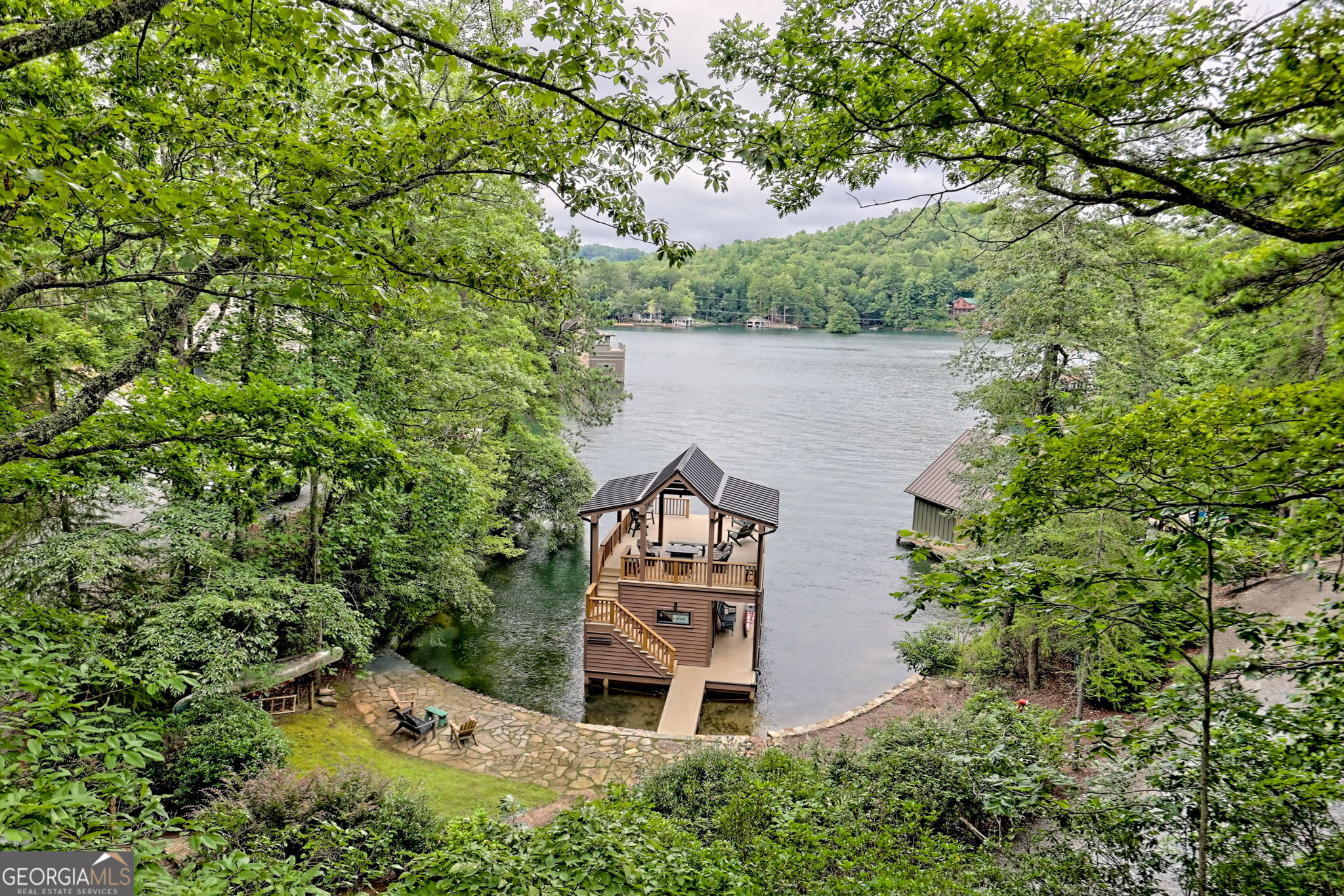 3019 Moccasin Creek Road Clarkesville, GA 30523 - Photo 34 of 72 an aerial view of a house with a yard and large trees