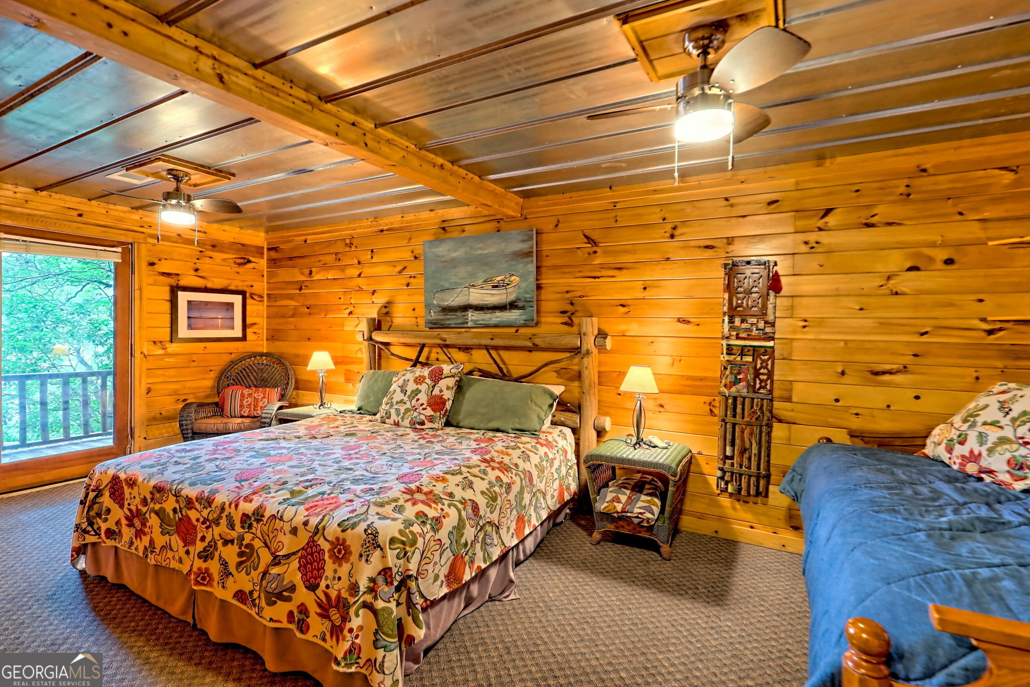 3019 Moccasin Creek Road Clarkesville, GA 30523 - Photo 40 of 72 a bed sitting in a bedroom next to a window