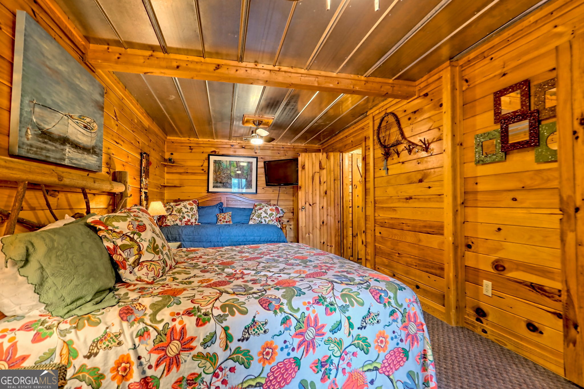 3019 Moccasin Creek Road Clarkesville, GA 30523 - Photo 41 of 72 a bedroom with a bed and wooden floor