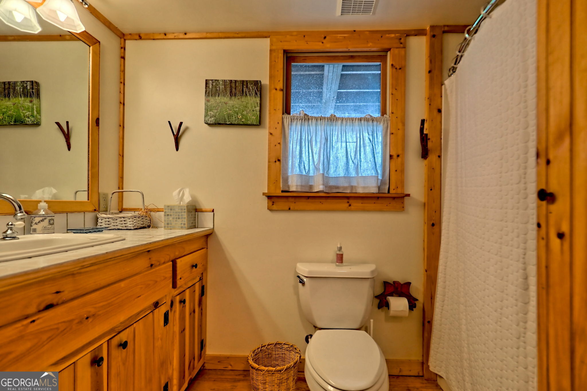 3019 Moccasin Creek Road Clarkesville, GA 30523 - Photo 43 of 72 a bathroom with a granite countertop sink toilet and shower