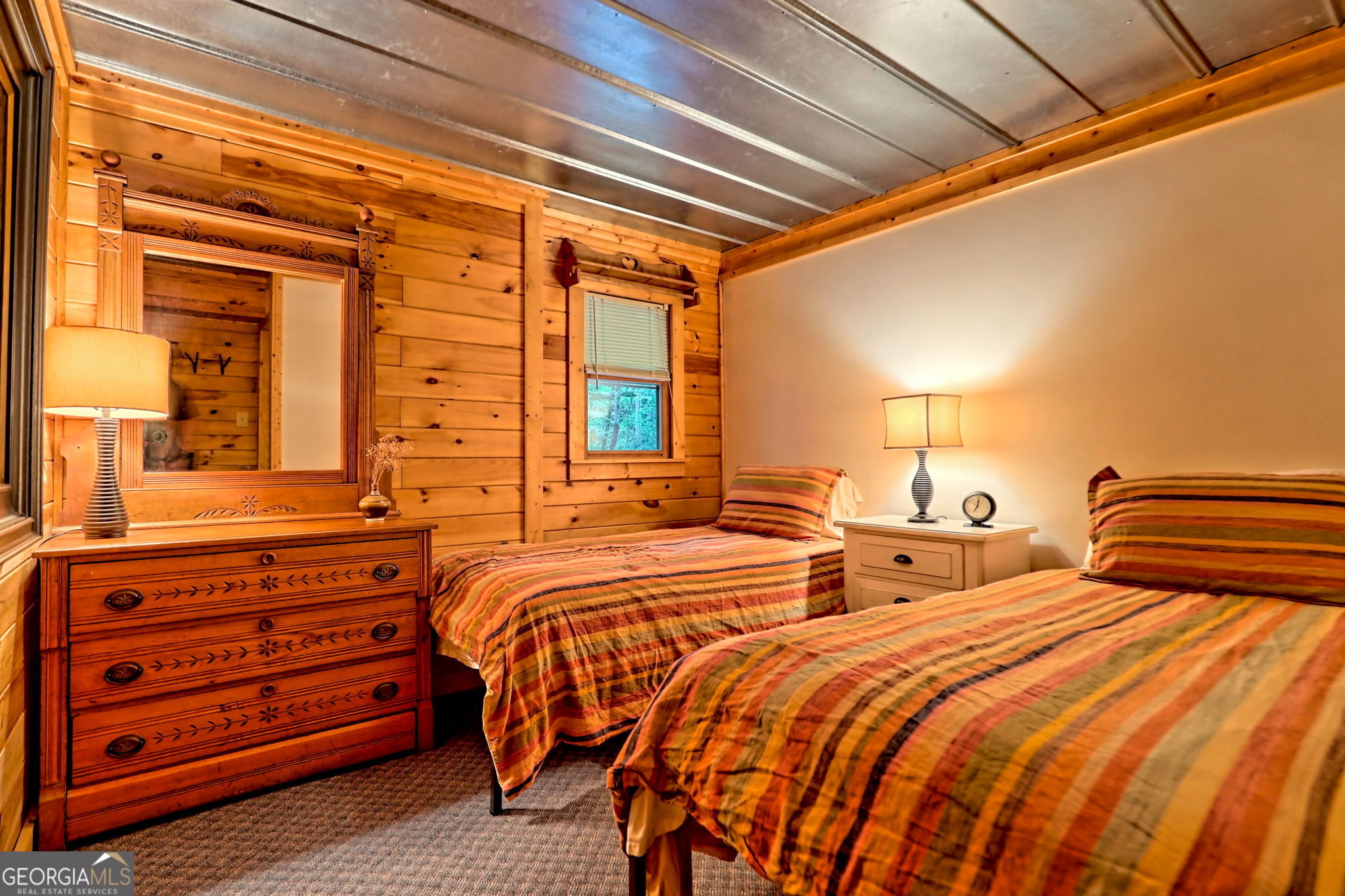 3019 Moccasin Creek Road Clarkesville, GA 30523 - Photo 45 of 72 a bedroom with two beds and painting on the wall