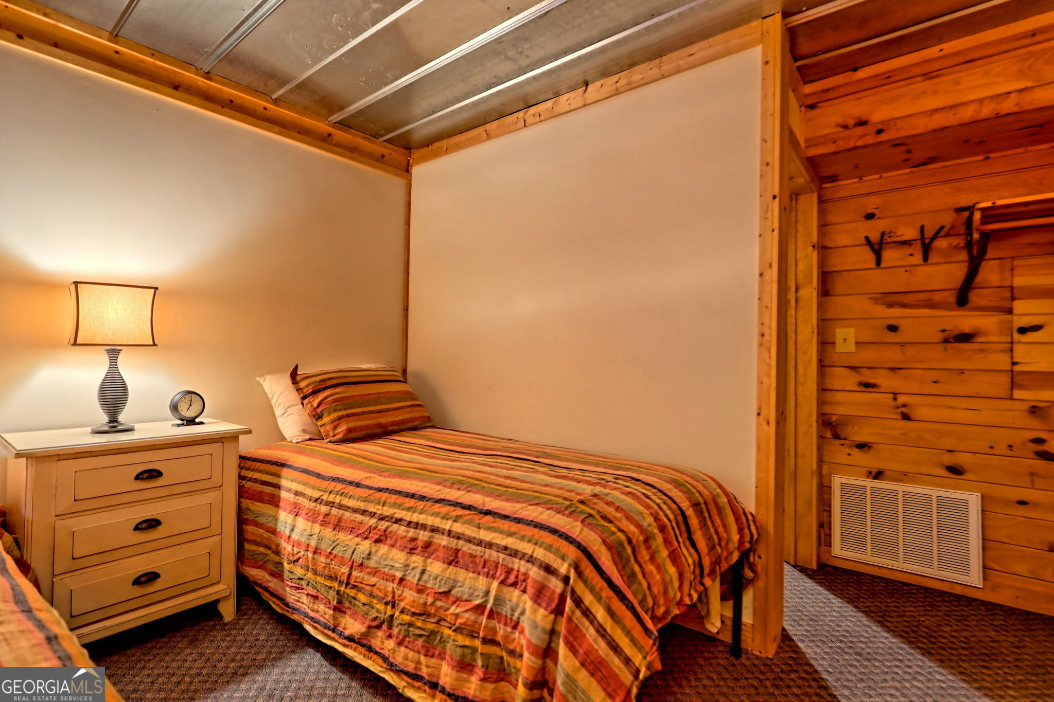 3019 Moccasin Creek Road Clarkesville, GA 30523 - Photo 46 of 72 a bedroom with a bed and wooden floor