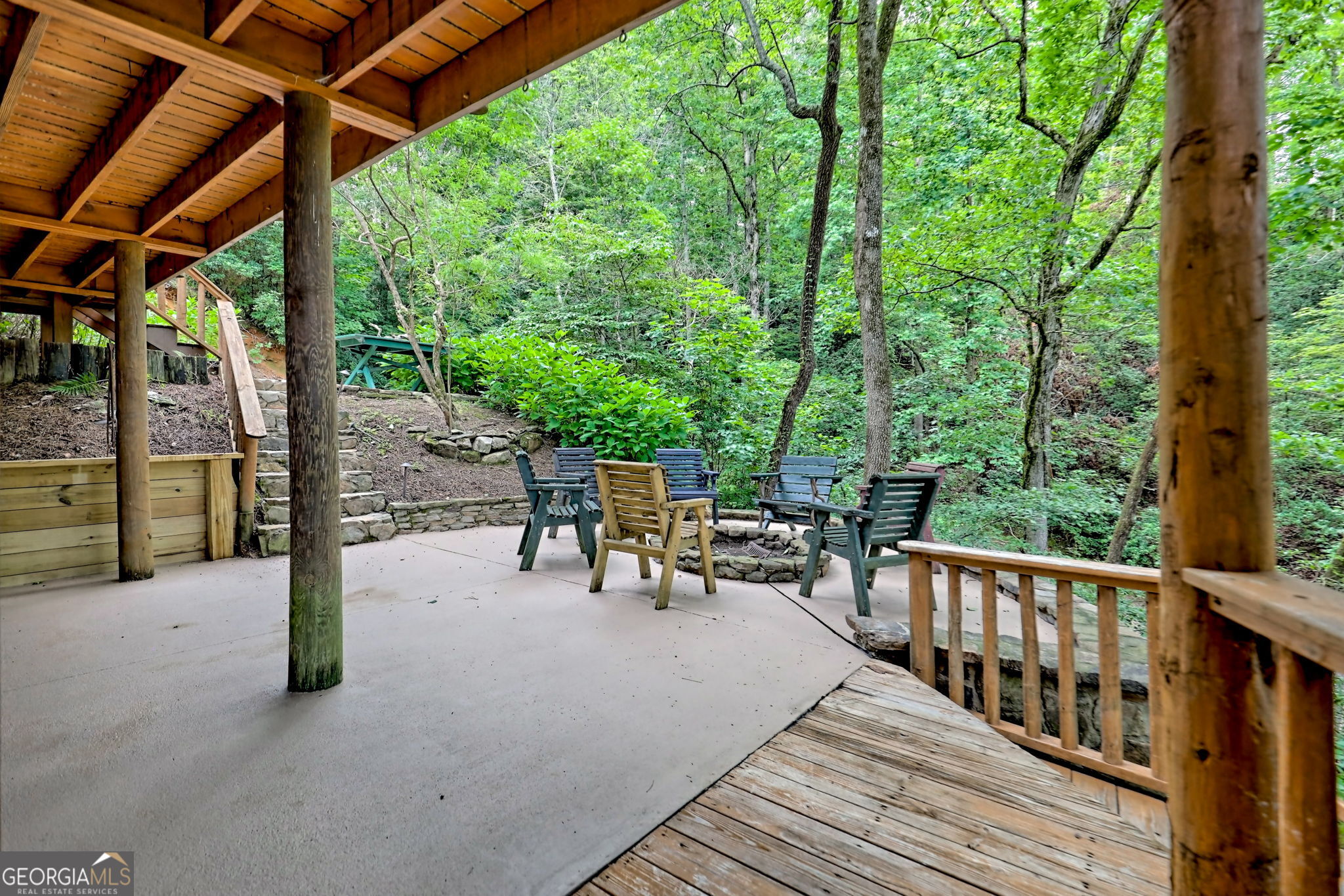 3019 Moccasin Creek Road Clarkesville, GA 30523 - Photo 48 of 72 a view of a patio with table and chairs and wooden floor