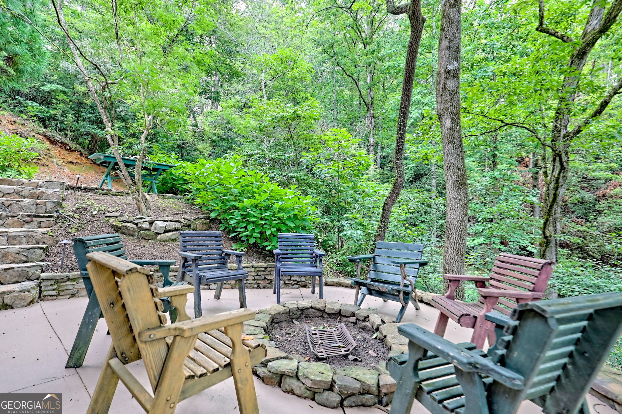 3019 Moccasin Creek Road Clarkesville, GA 30523 - Photo 49 of 72 a view of a patio with table and chairs and potted plants