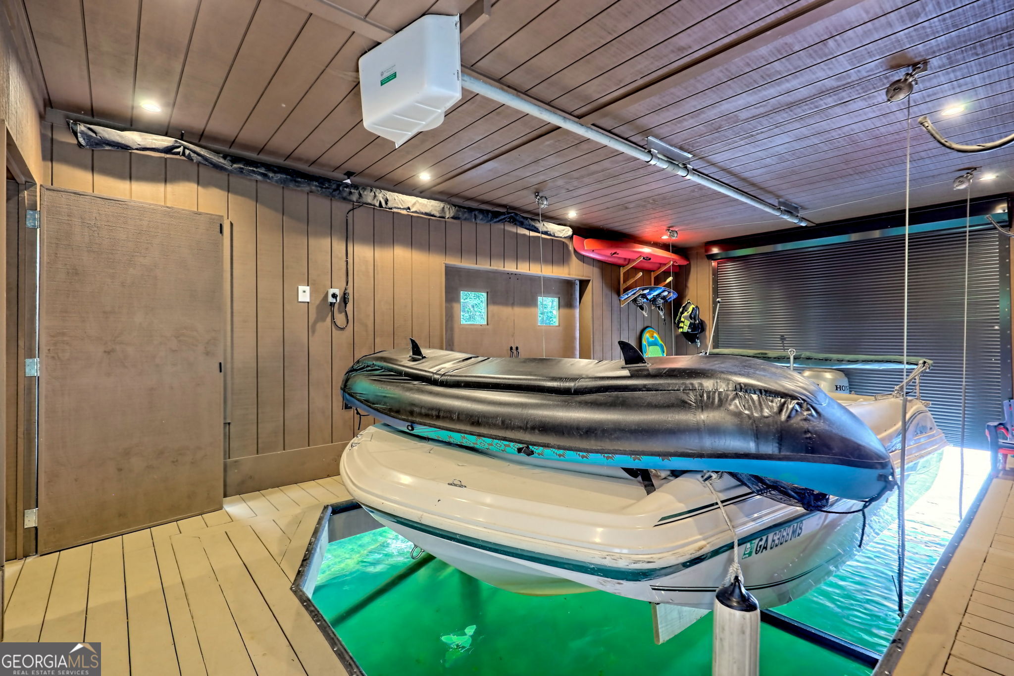 3019 Moccasin Creek Road Clarkesville, GA 30523 - Photo 59 of 72 a room with table chairs and wooden walls