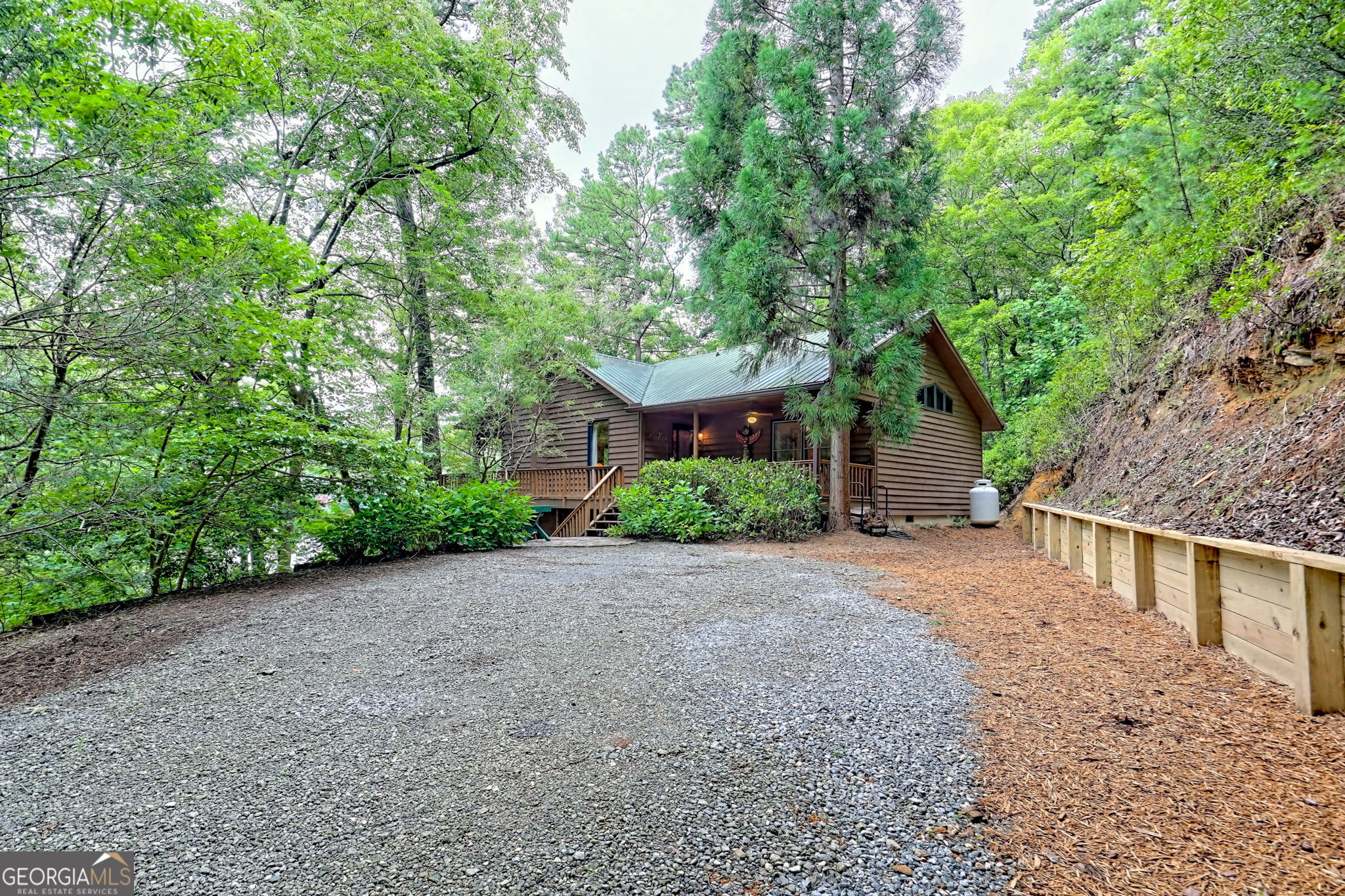 3019 Moccasin Creek Road Clarkesville, GA 30523 - Photo 7 of 72 a view of a house with a tree in front of it