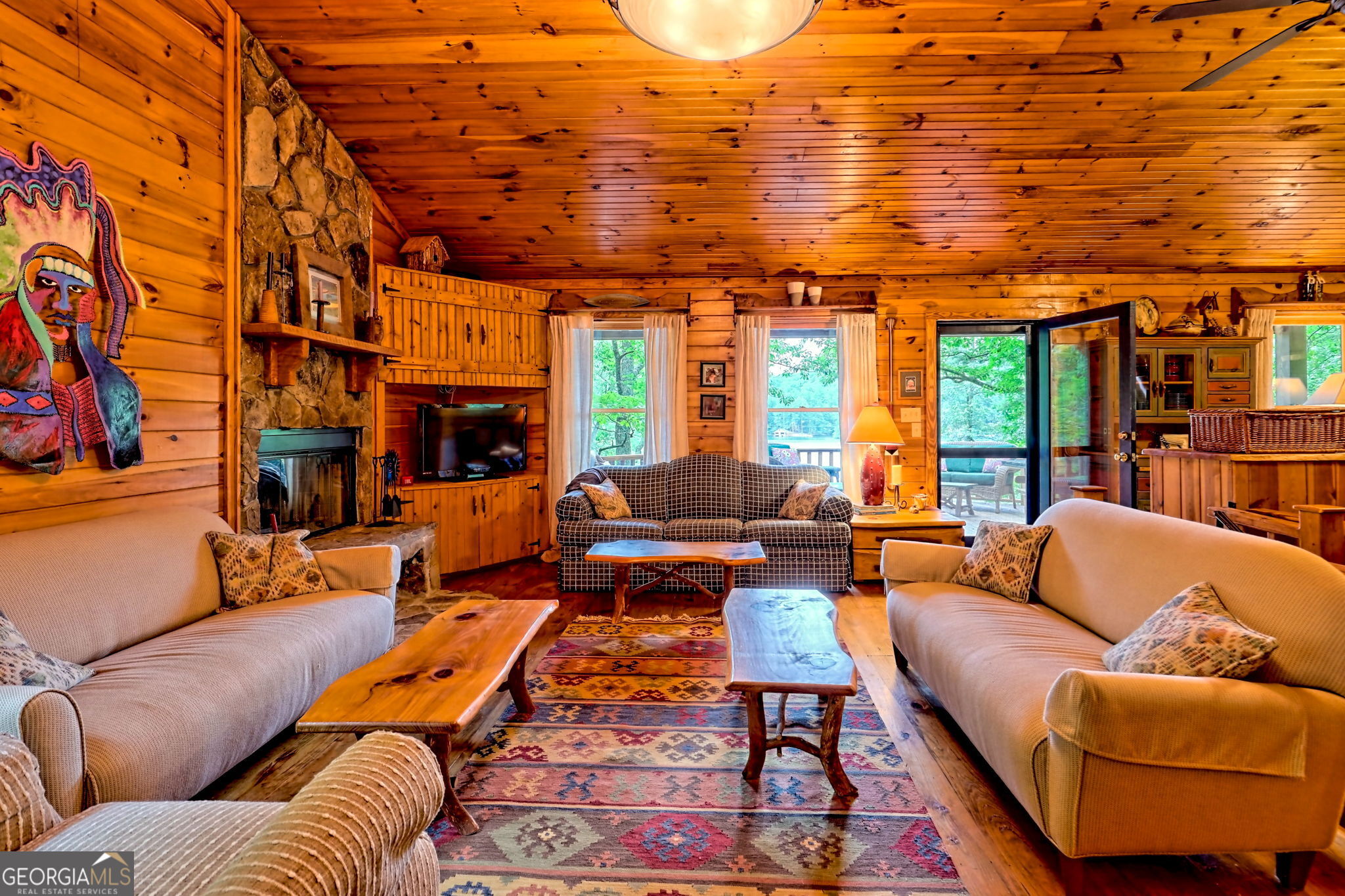 3019 Moccasin Creek Road Clarkesville, GA 30523 - Photo 10 of 72 a living room with furniture a fireplace and city view