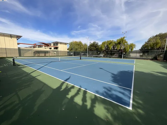 a view of an outdoor space and tennis court