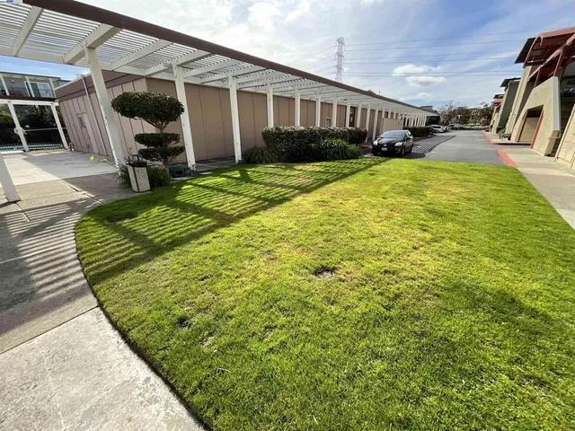 a view of a house with backyard porch and sitting area