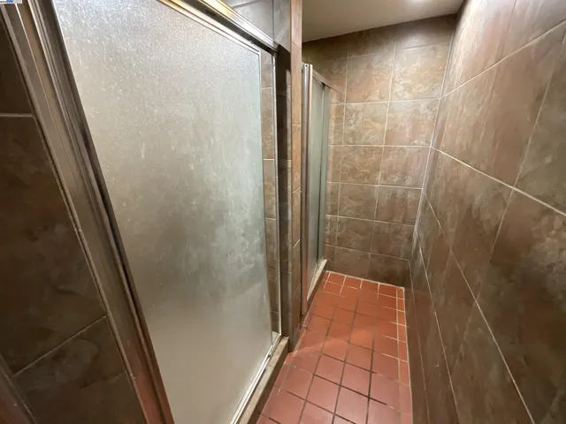 a bathroom with a glass door shower