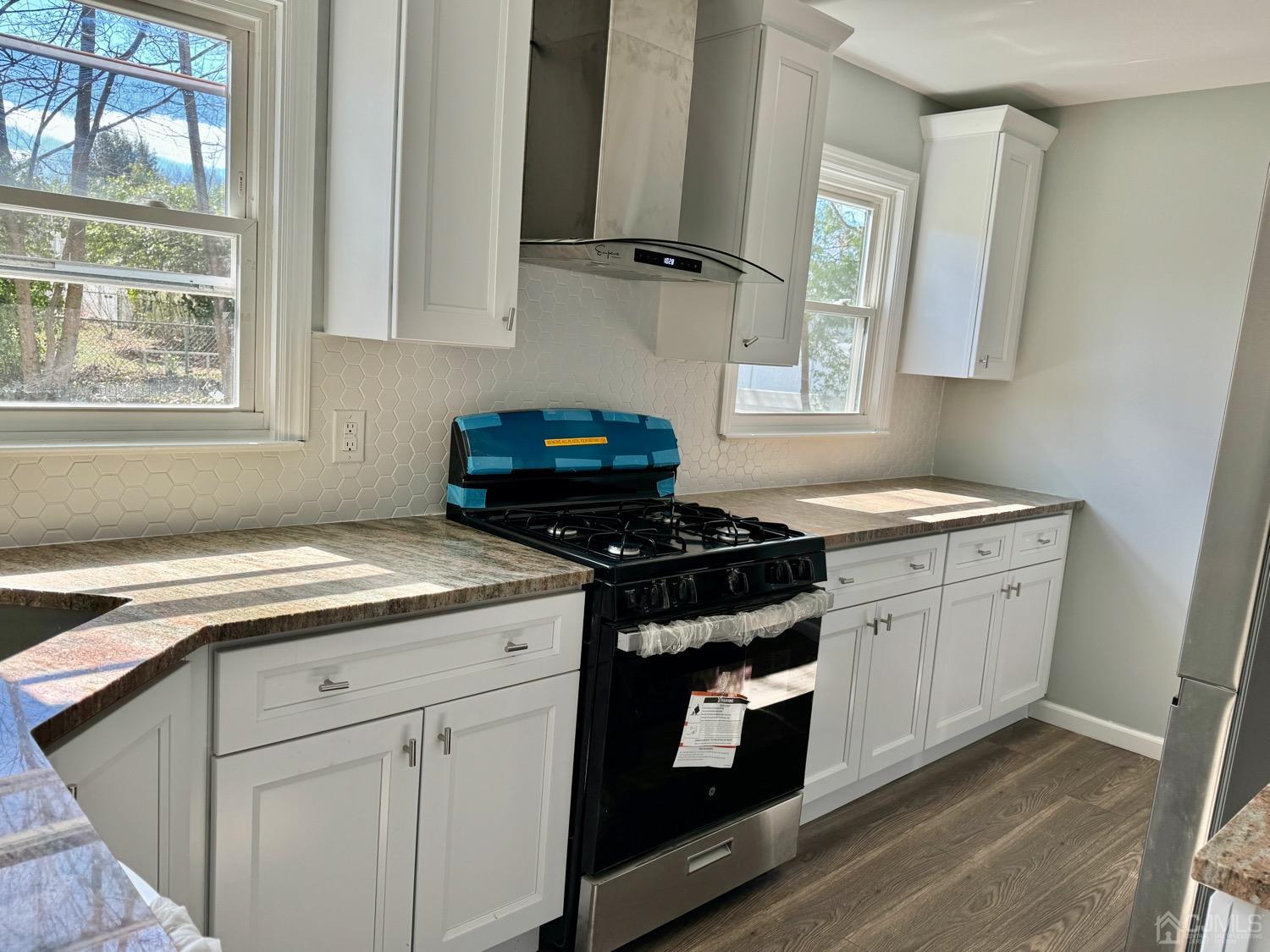 93 Tunison Road New Brunswick, NJ 08901 - Photo 17 of 19 a kitchen with granite countertop cabinets stainless steel appliances and a sink