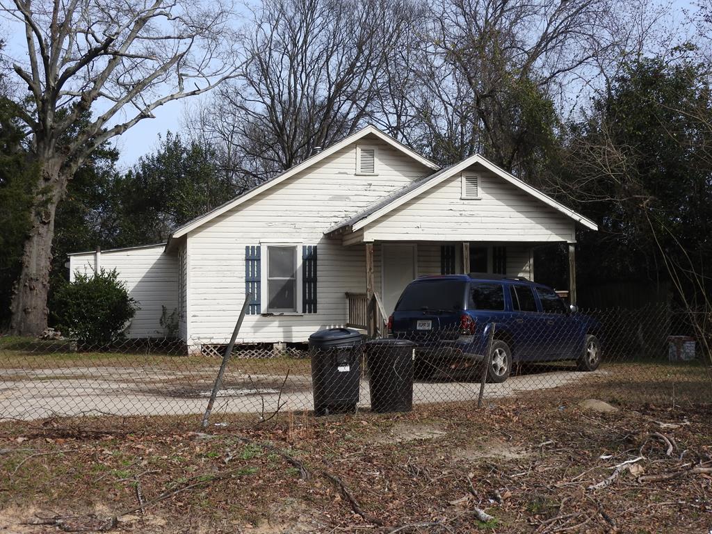 610 32nd Street Columbus, GA 31904 - Photo 5 of 5 a front view of house with yard and trees in the background