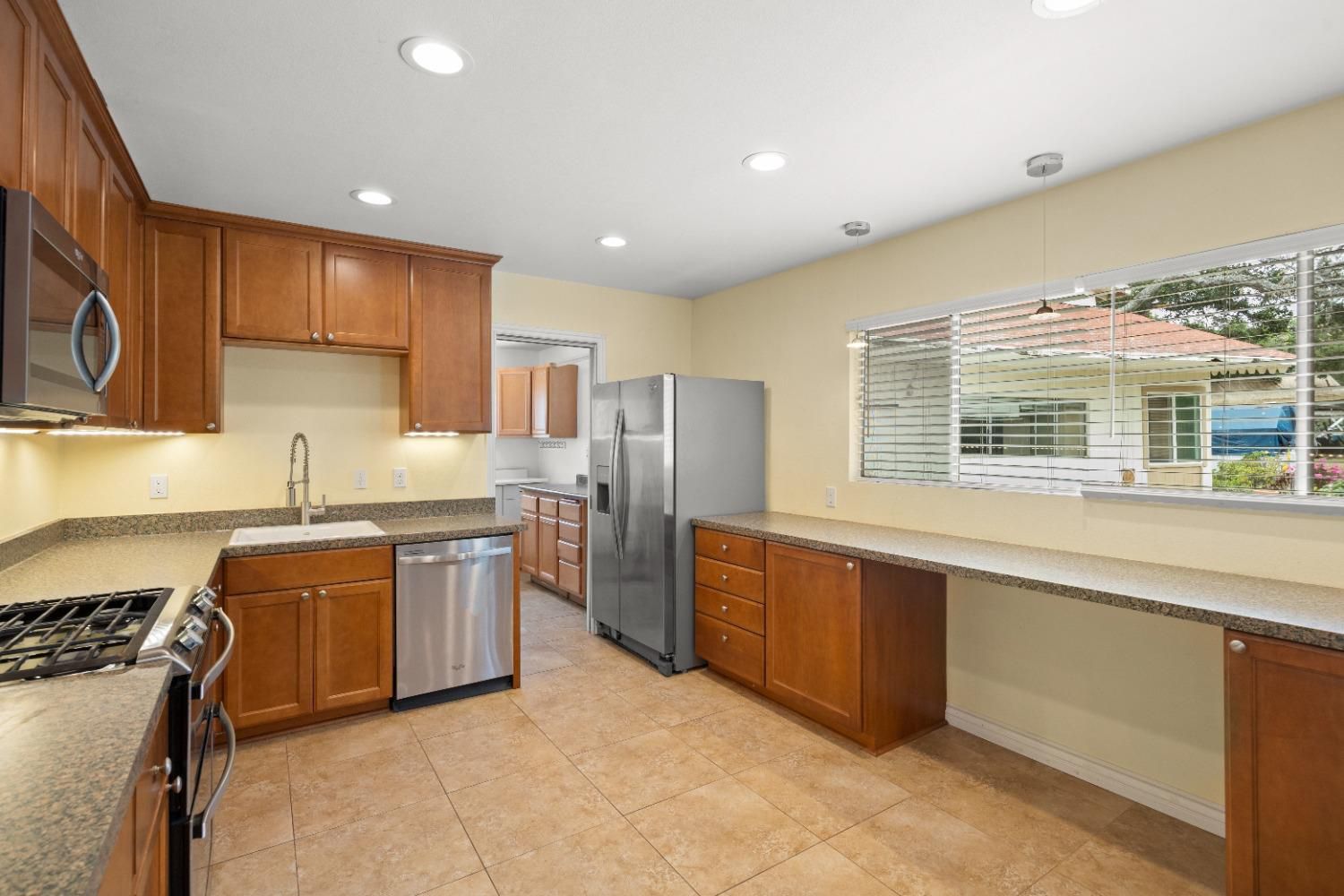 272 Rockaway Road Oak View, CA 93022 - Photo 11 of 33 a kitchen with stainless steel appliances granite countertop a stove and a sink