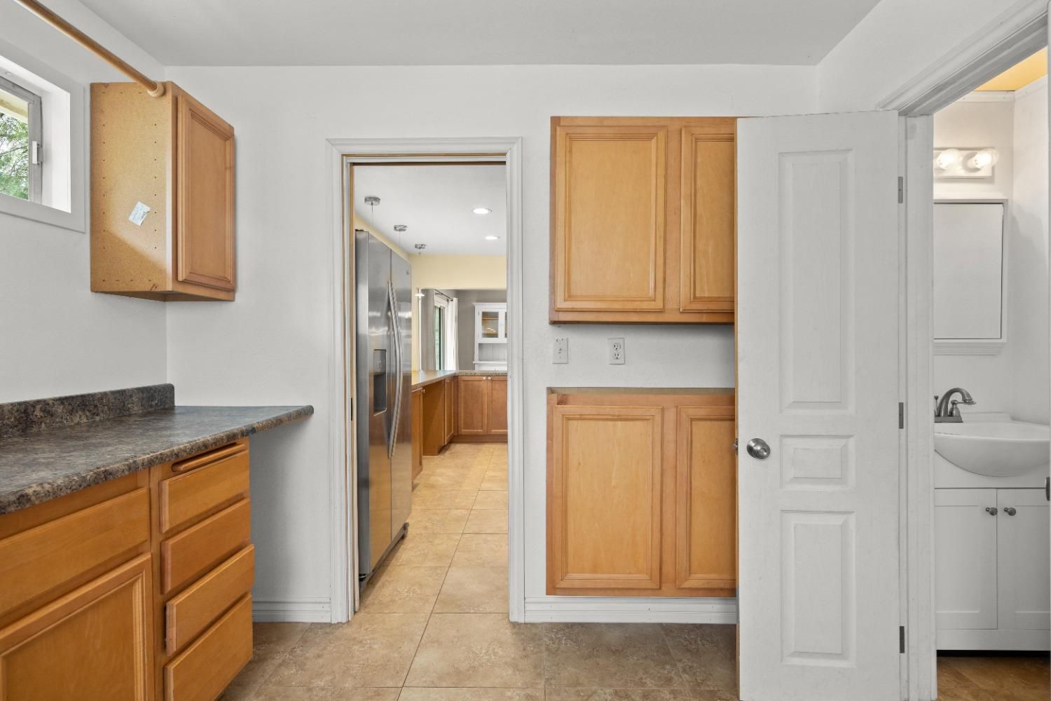 272 Rockaway Road Oak View, CA 93022 - Photo 14 of 33 a spacious bathroom with a granite countertop sink and a mirror