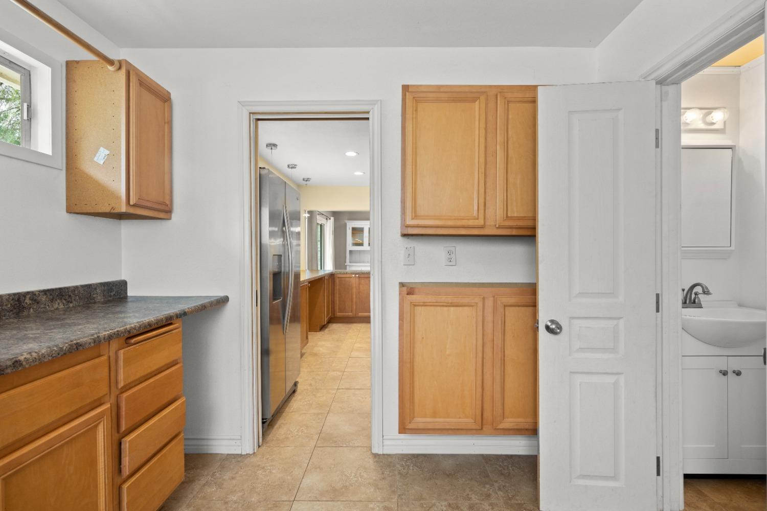 272 Rockaway Road Oak View, CA 93022 - Photo 28 of 33 a spacious bathroom with a granite countertop sink and a mirror