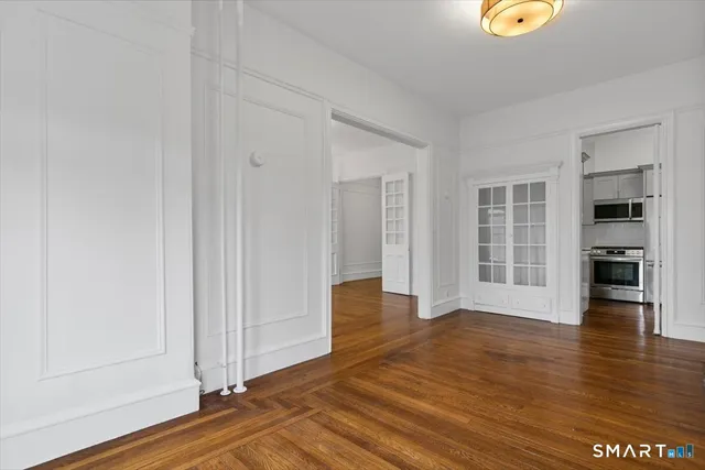 a view of a livingroom with wooden floor