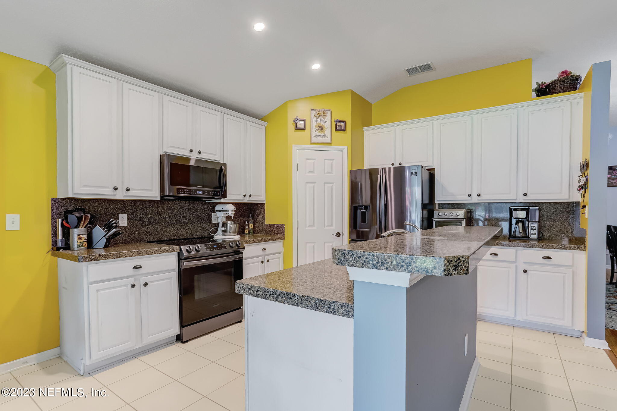 1564 Summerdown Way St. Johns, FL 32259 - Photo 15 of 83 a kitchen with stainless steel appliances granite countertop a stove top oven a sink dishwasher and a refrigerator