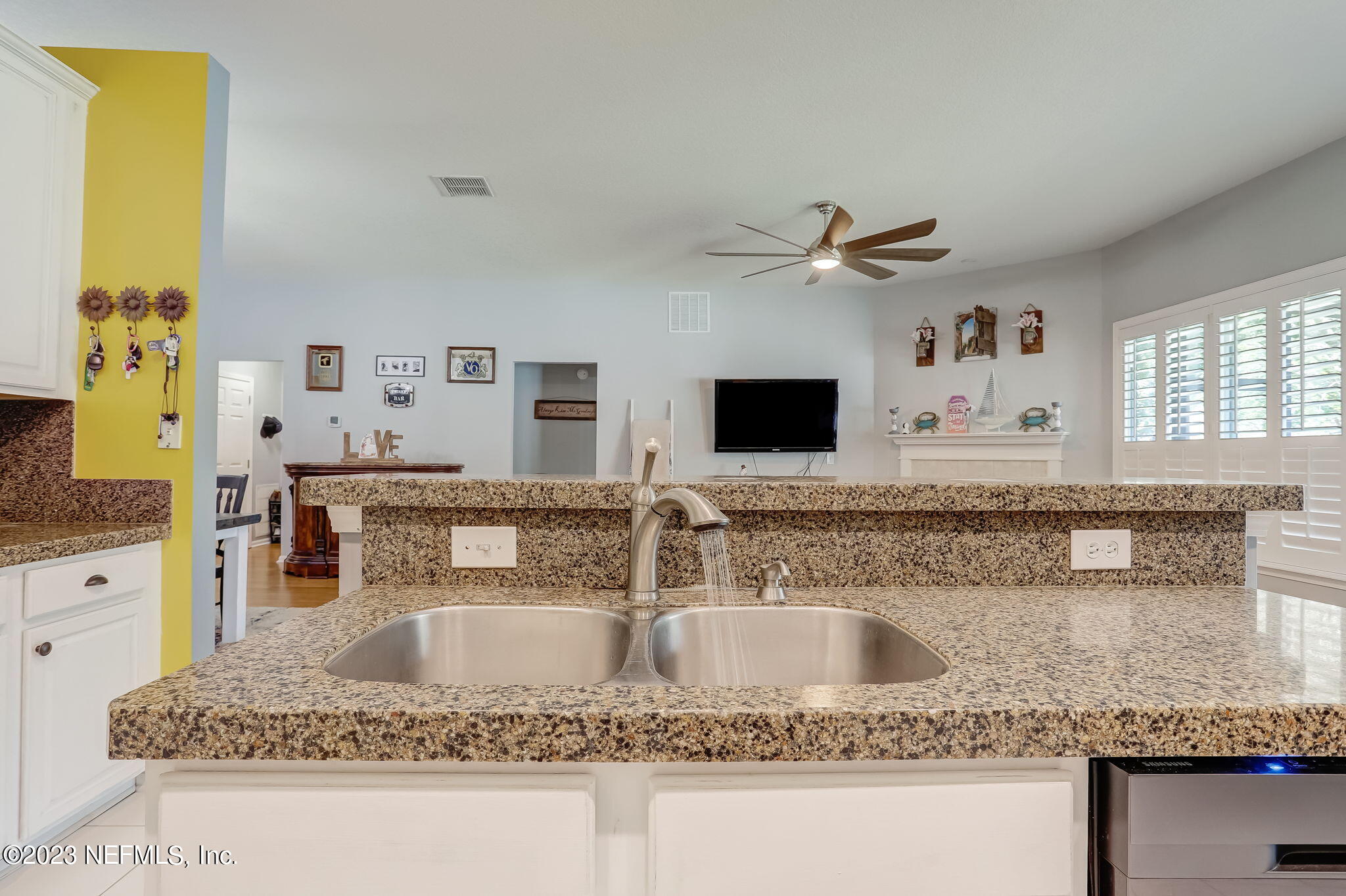 1564 Summerdown Way St. Johns, FL 32259 - Photo 19 of 83 a kitchen with kitchen island granite countertop a sink a counter top space and cabinets