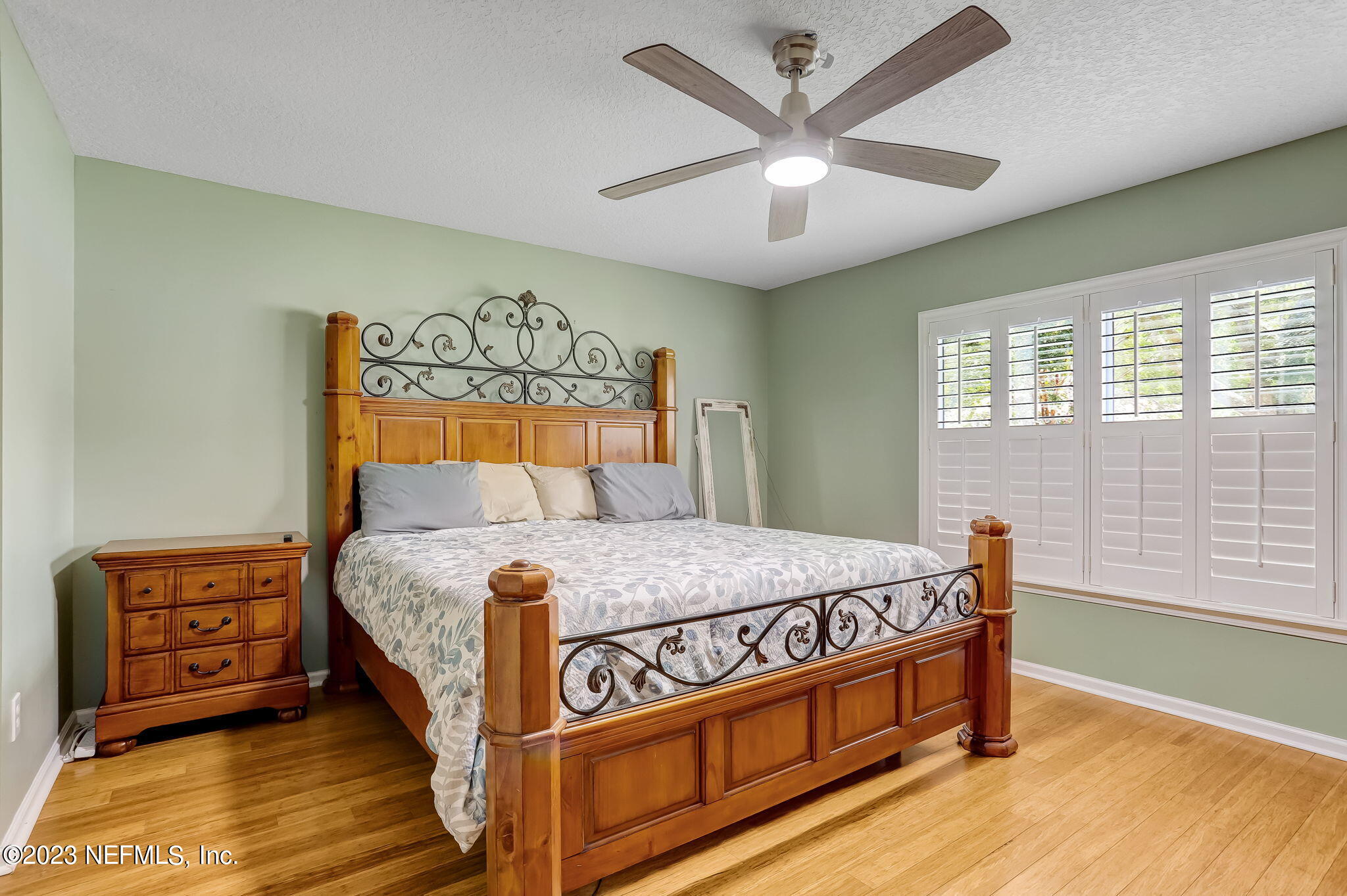 1564 Summerdown Way St. Johns, FL 32259 - Photo 23 of 83 a bed sitting in a bedroom next to a window
