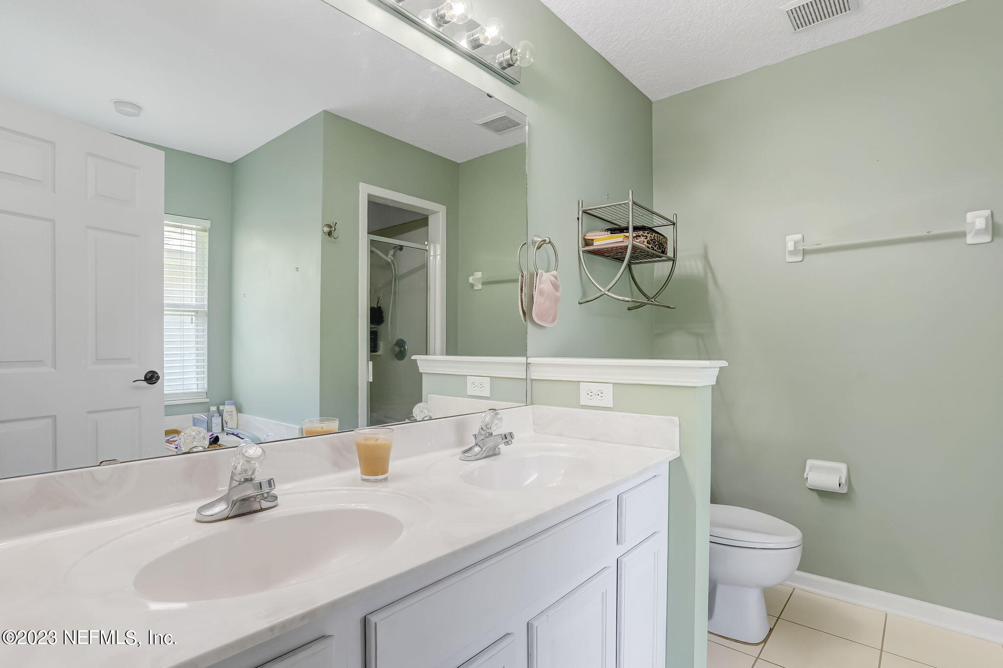 1564 Summerdown Way St. Johns, FL 32259 - Photo 27 of 83 a bathroom with a granite countertop sink a toilet and a mirror