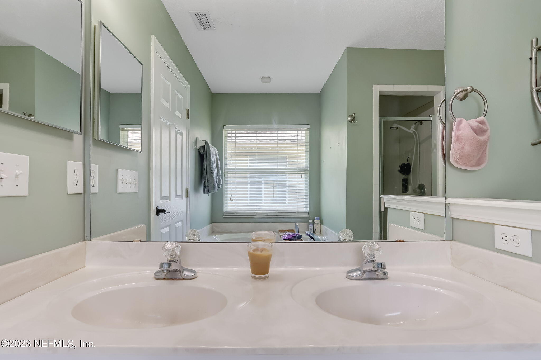 1564 Summerdown Way St. Johns, FL 32259 - Photo 28 of 83 a bathroom with a double vanity sink and a mirror