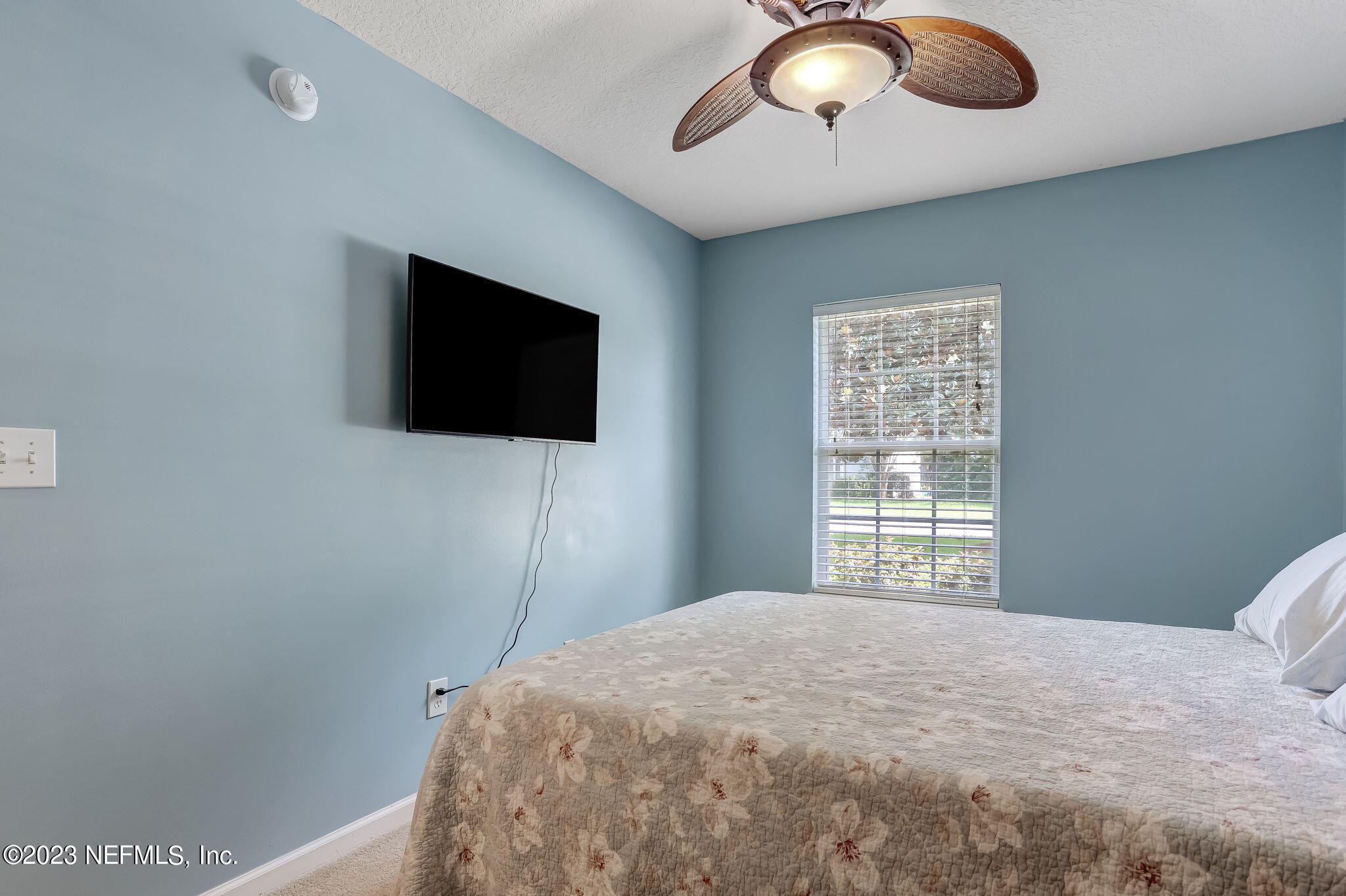 1564 Summerdown Way St. Johns, FL 32259 - Photo 31 of 83 a bedroom with a bed and a flat screen tv