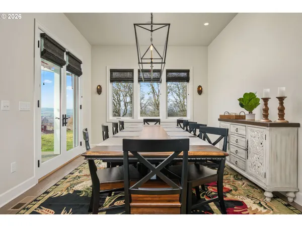 a view of a dining room with furniture and window