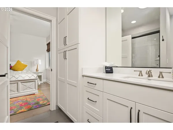 a bathroom with a sink double vanity and a mirror
