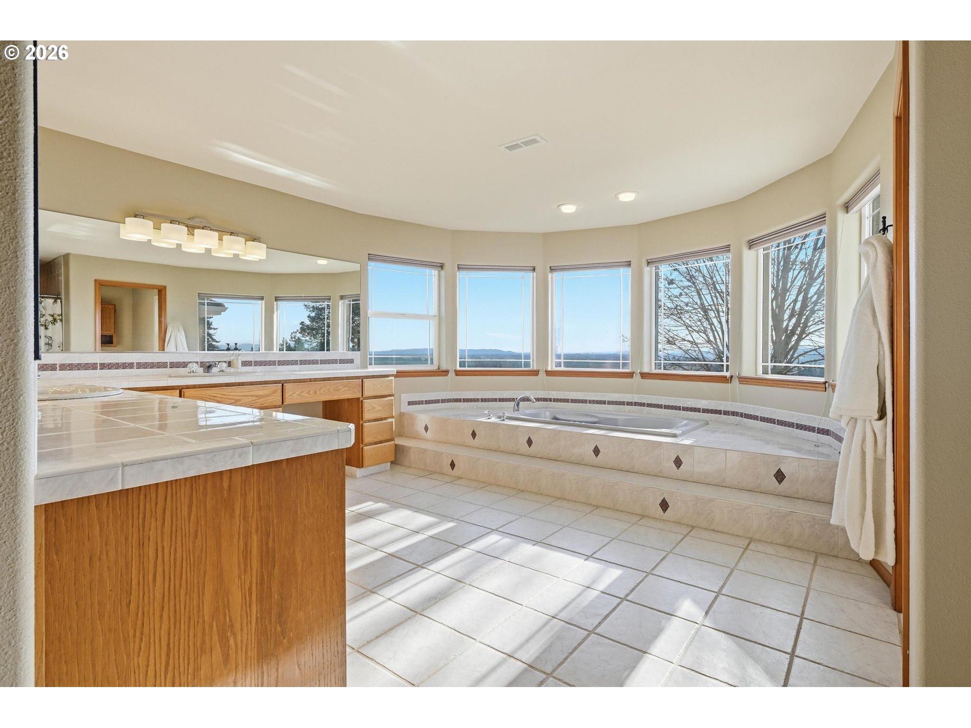 15682 Northeast Yamhill Road Yamhill, OR 97148 - Photo 35 of 47 a bathroom with a tub a sink and a mirror